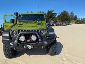 Green Jeep exploring the Oregon Dunes Recreation Area